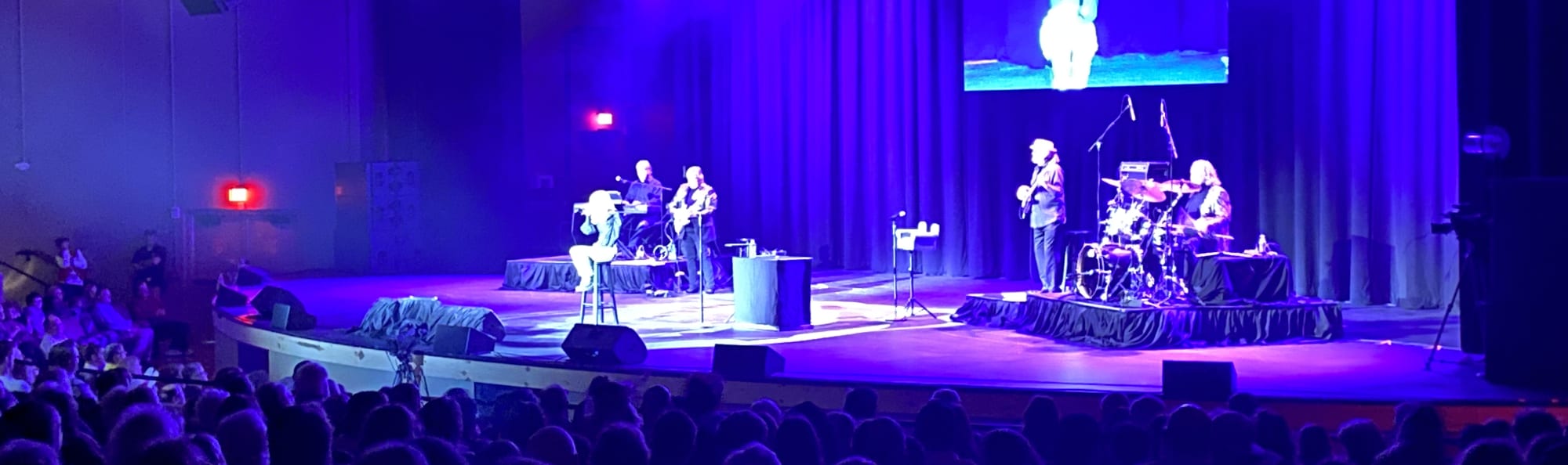 signer on stage in chair washed out by the lights Lehigh Valley